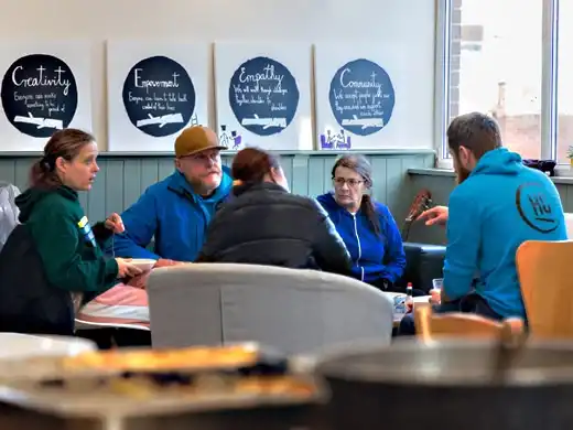 People chatting in a Handcrafted support group